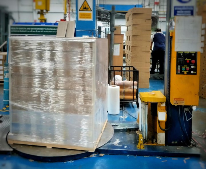 wrapped stack of pallets in warehouse