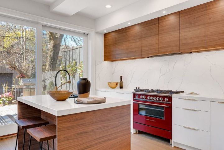 kitchen with white walls and countertops and wood cabinets