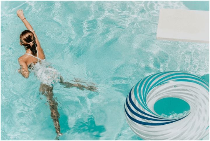 young woman swimming in a pool