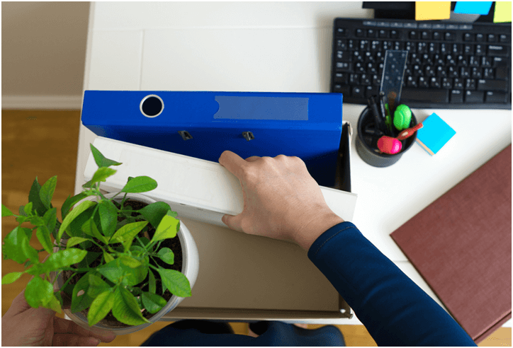 woman packing desk to prepare for moving