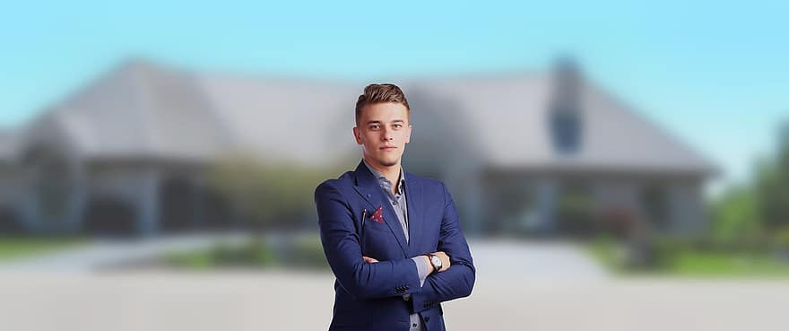 young realtor in front of a house