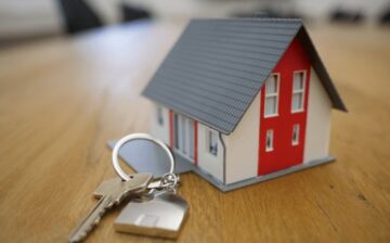 model of a house with key in front