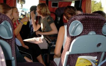 children riding in an RV