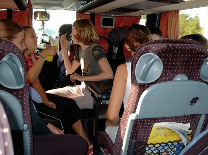 children riding in an RV