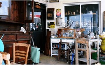 room cluttered with old furniture