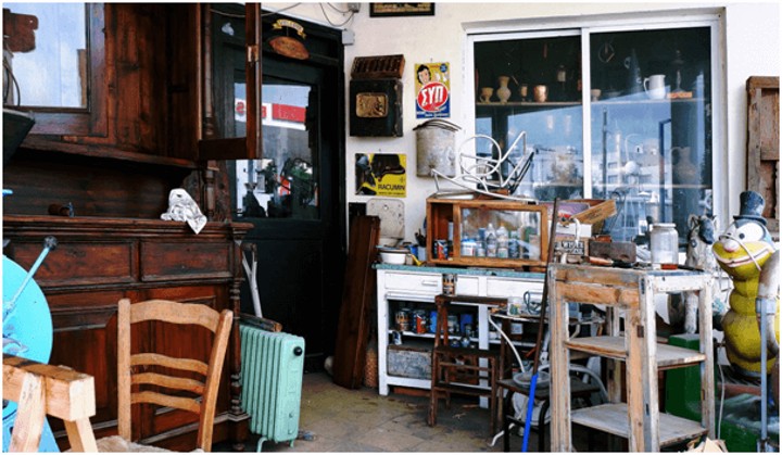 room cluttered with old furniture