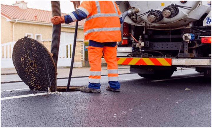 sewage system worker at work