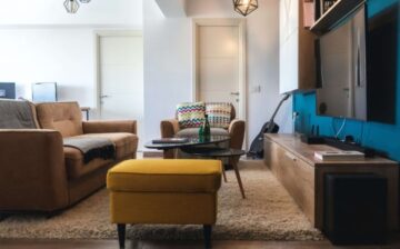 living room with maroon sofa and carpet