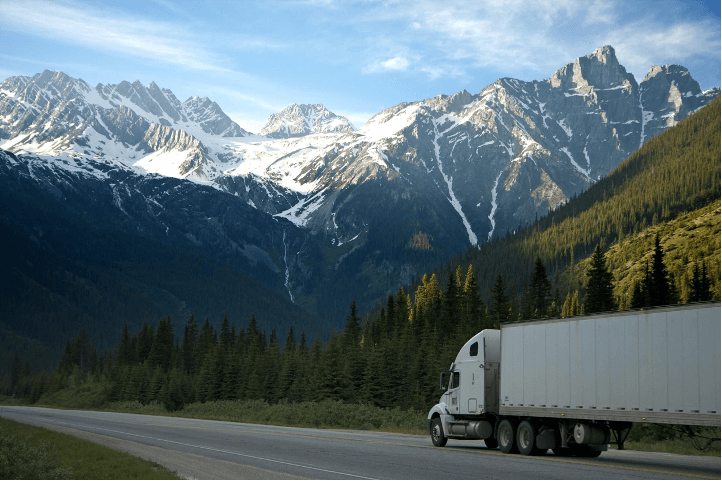 truck driving through mountainous terrain