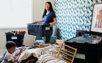 woman and young child packing boxes