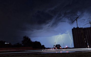 Freight being shipped down a road during stormy weather