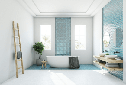 bathroom with blue walls and tub with two windows behind it
