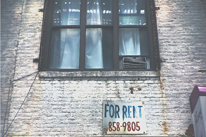 building with for rent sign
