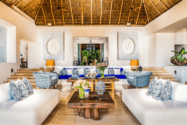 Mexican style home with colorful pillows and straw roof