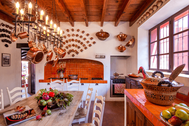 dining room with wooden table and red tile countertops