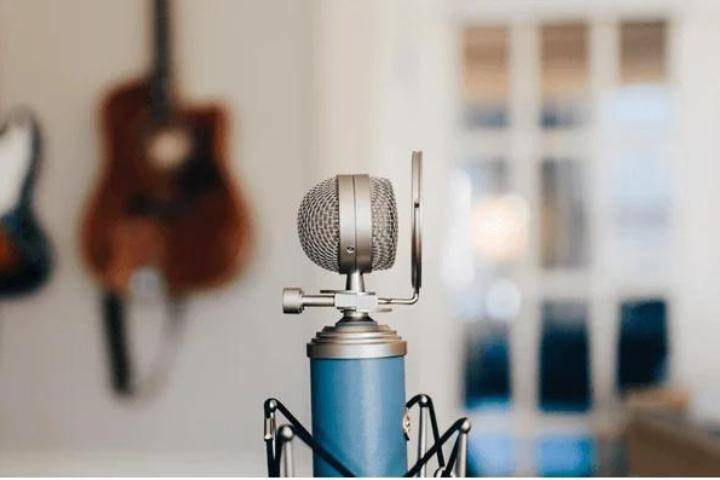 microphone in music room with guitar