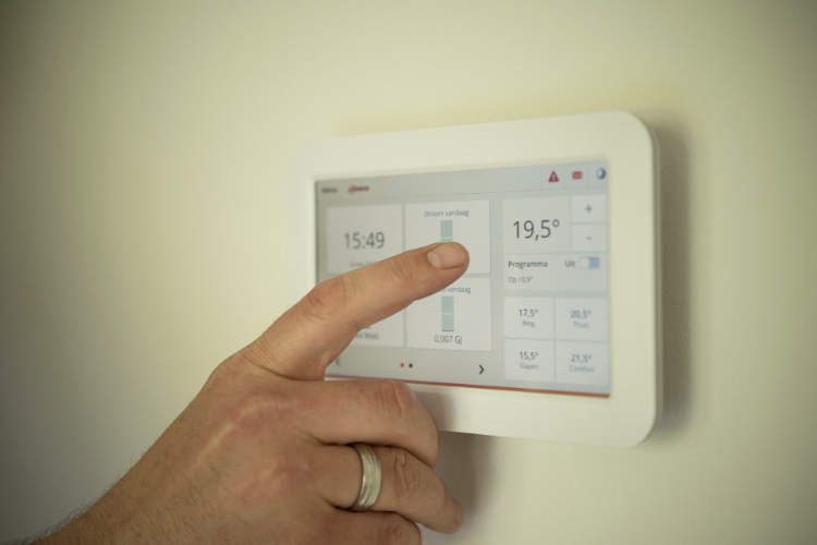 adjusting programmable smart thermostat