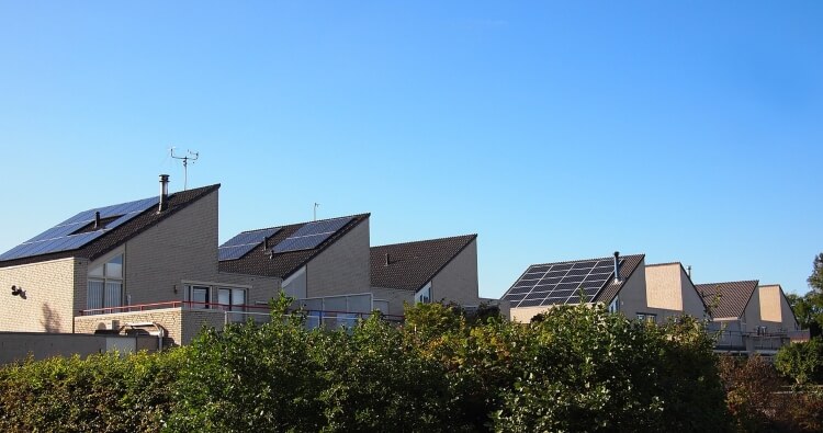 houses with sloped roofs with solar panels installed