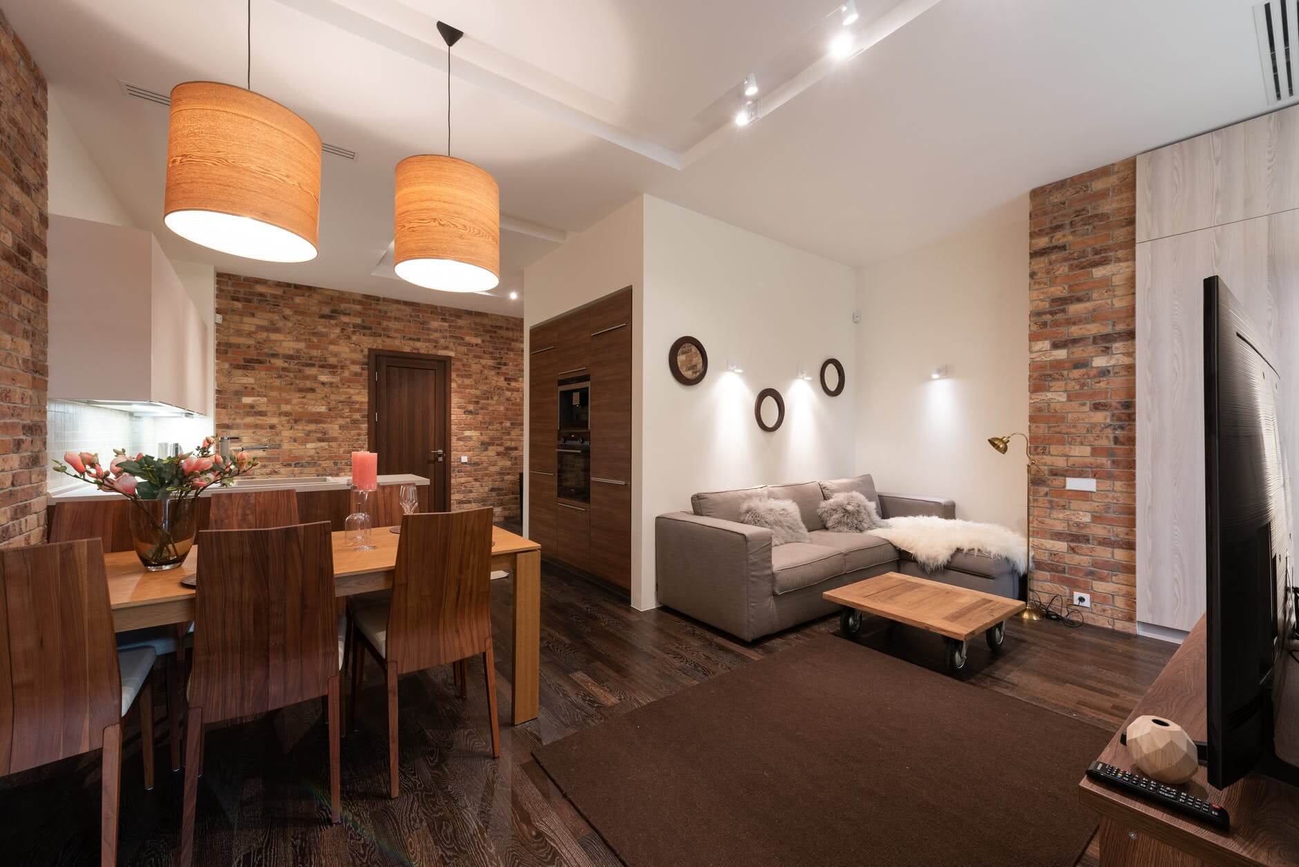 home lounge area with white tray ceiling