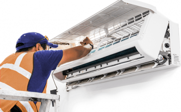 Professional air conditioning contractor servicing an air-con unit
