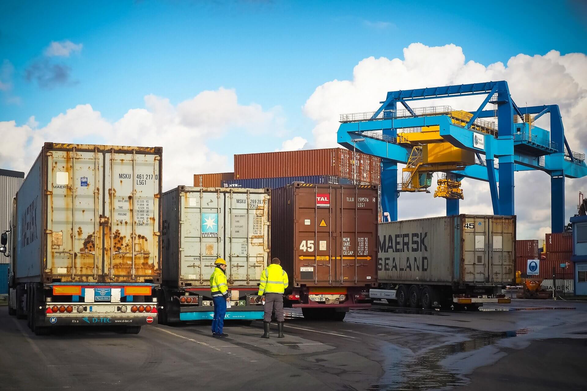 trucks and shipping containers at a port