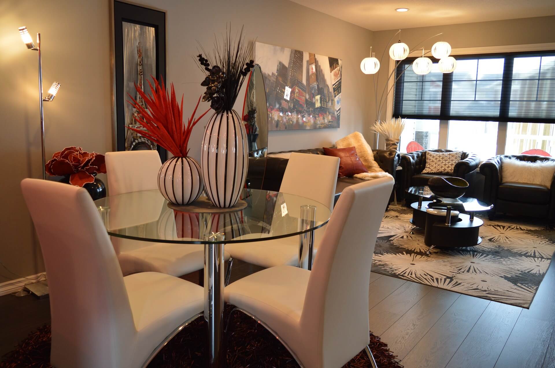 dining and living rooms with natural lighting and lamps