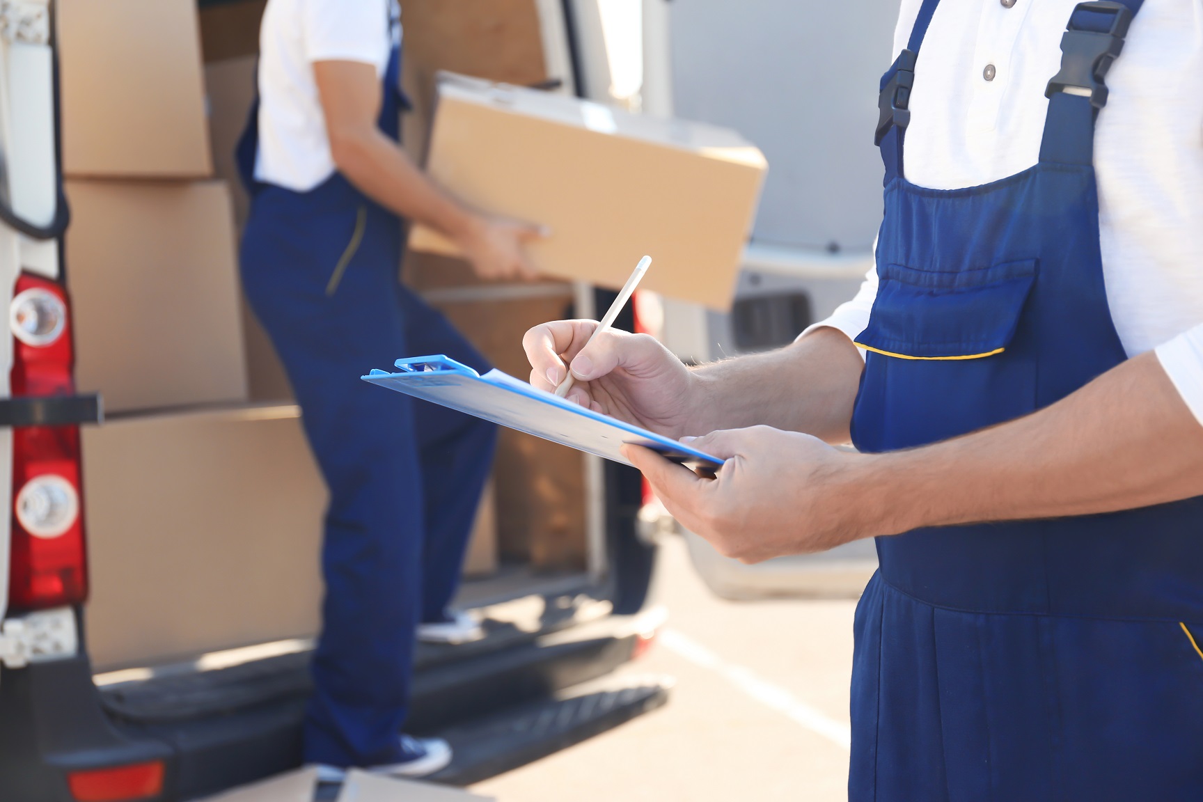 movers unloading boxes from a truck