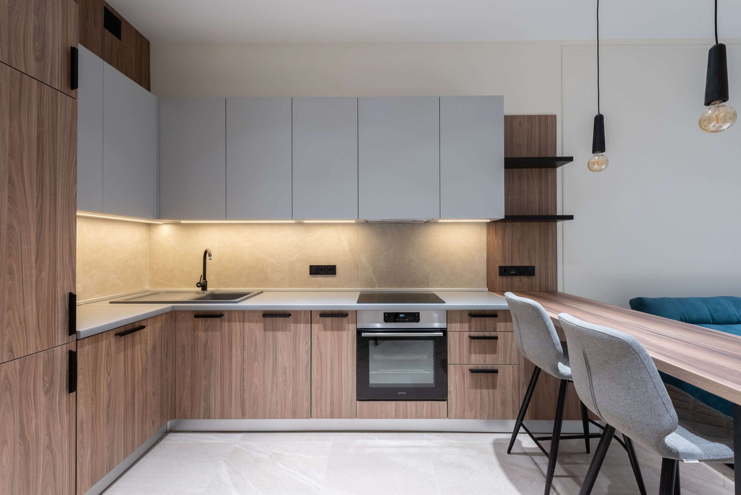 bare kitchen with cabinets and shelves