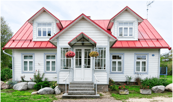 one-story house with white exterior and red roof