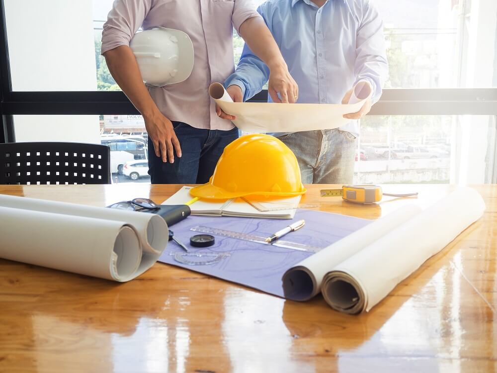 designers reviewing home blueprints