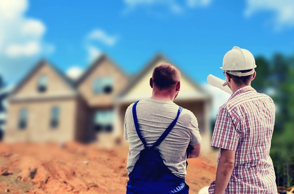 builders reviewing a home under construction