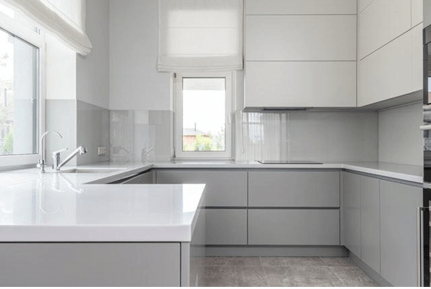 kitchen with white cabinets and countertops