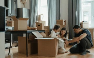 family labeling moving boxes