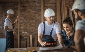 group working on house plans