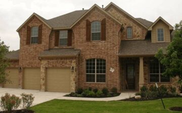 large house with two floors and three garages