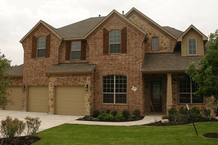 large house with two floors and three garages