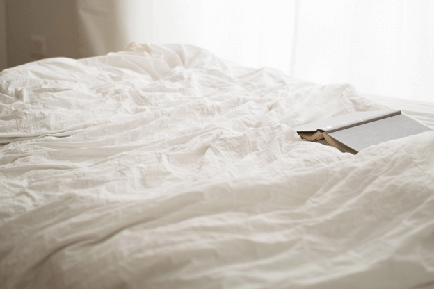 closeup view of a bed recently slept in