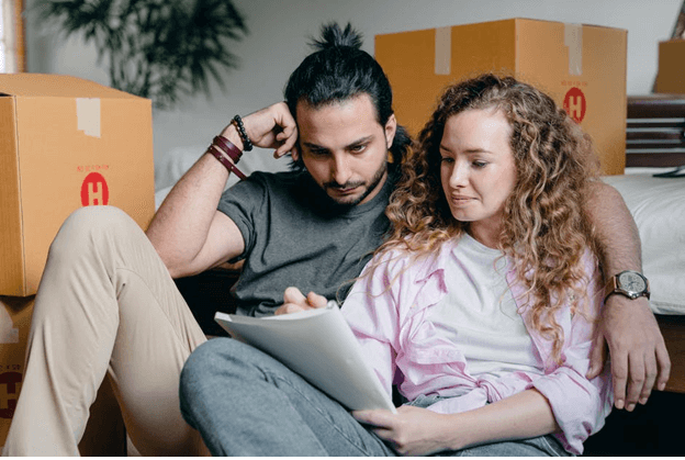 young couple reviewing a moving plan