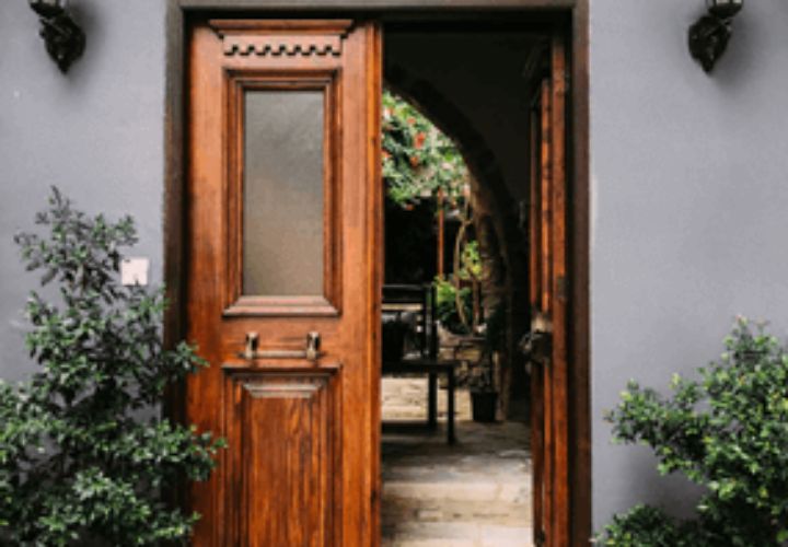 wooden exterior doors leading to garden