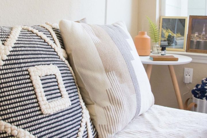 decorative pillows on bed