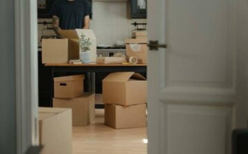 man preparing moving boxes