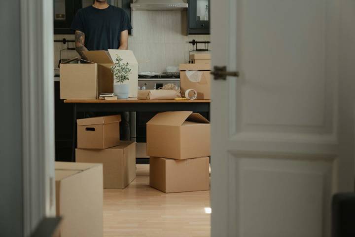 man preparing moving boxes