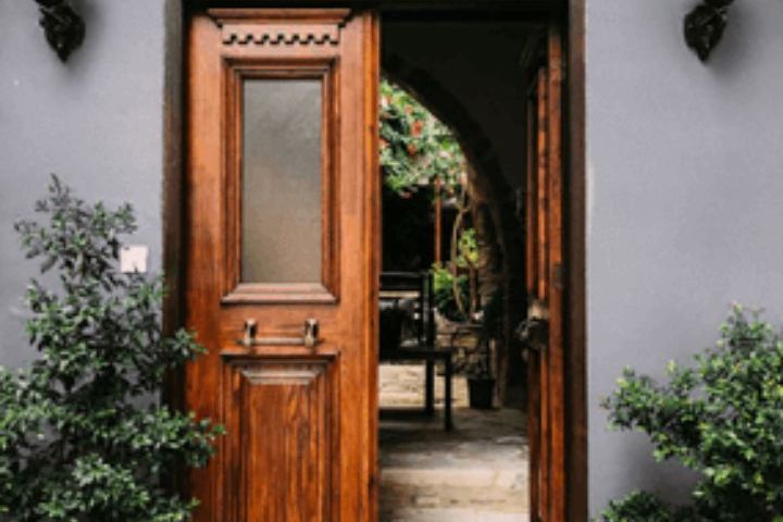 wooden door at home with plants
