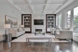 living room decorated in white color scheme with large windows