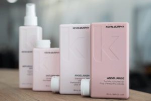 set of Kevin Murphy packages in different colors with k debossed on each