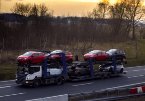 car transport truck moving down the highway