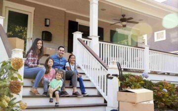 family at the entrance of a house