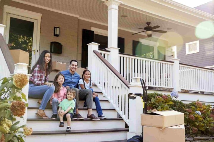 family at the entrance of a house