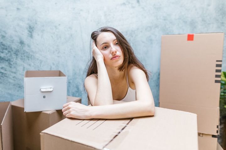 thoughtful-woman-with-moving-boxes.jpg