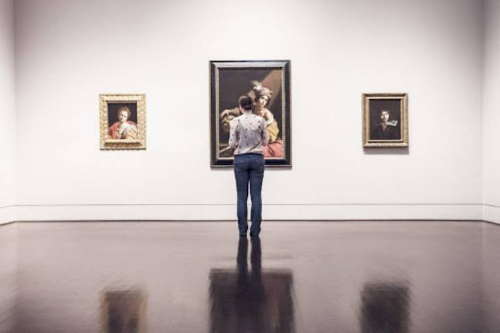 woman watching art exhibition